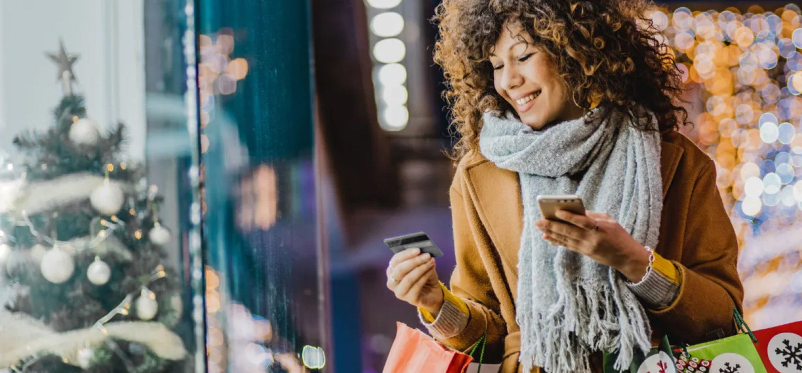 woman holiday shopping with credit card