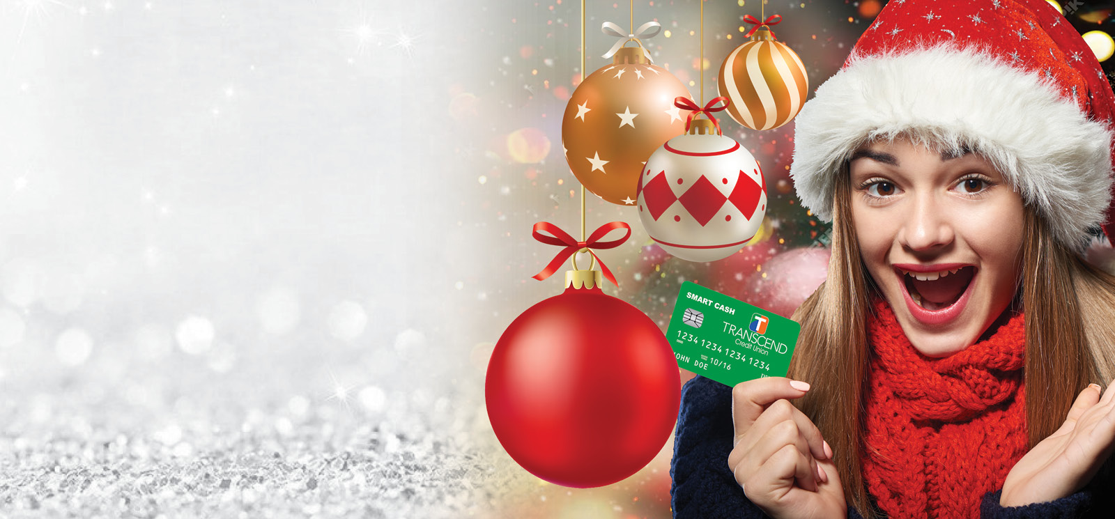 young girl wearing santa hat with her debit card