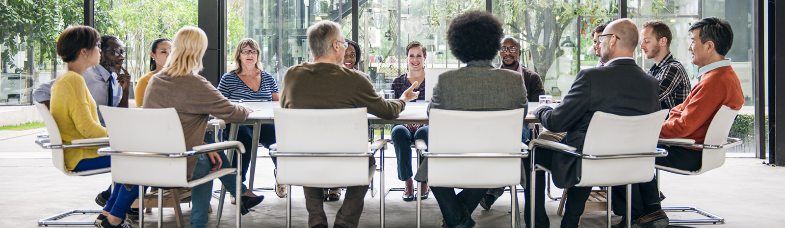 People meeting at a round table for a meeting